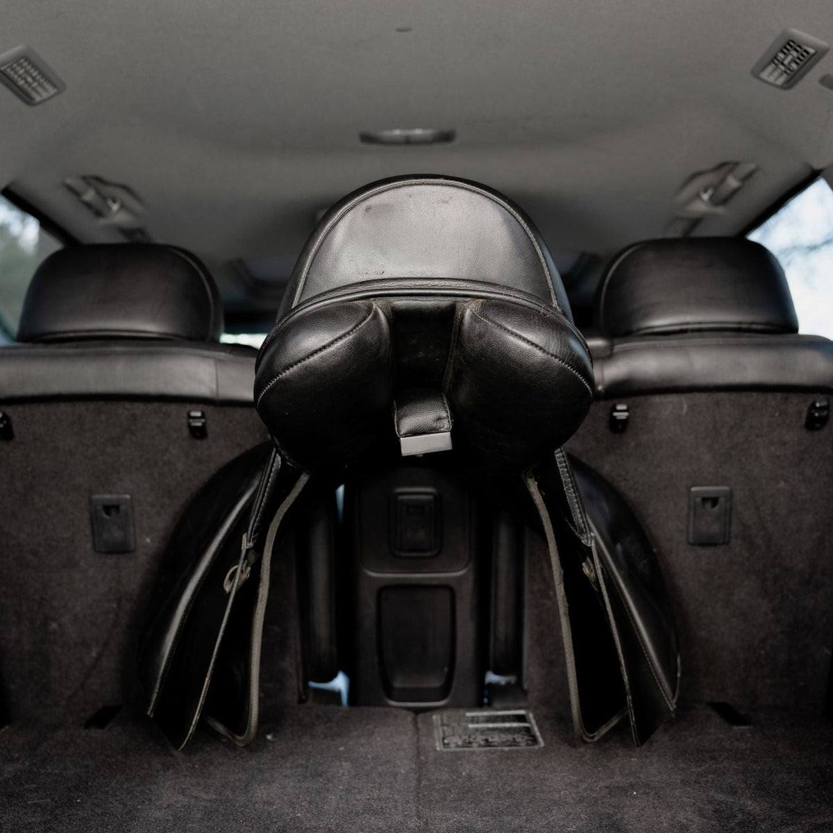 Lumiere Car Saddle Caddy - saddle on the caddy viewed from the boot
