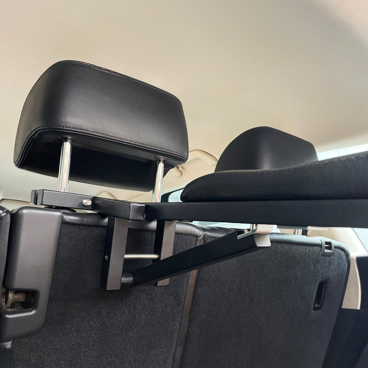 Lumiere Car Saddle Caddy - caddy arm fitted to the headrest, side view