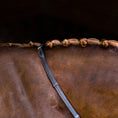 Load image into Gallery viewer, Lumiere Padded Nappa Leather Reins (Flat) - reins lying along a plaited horse's neck
